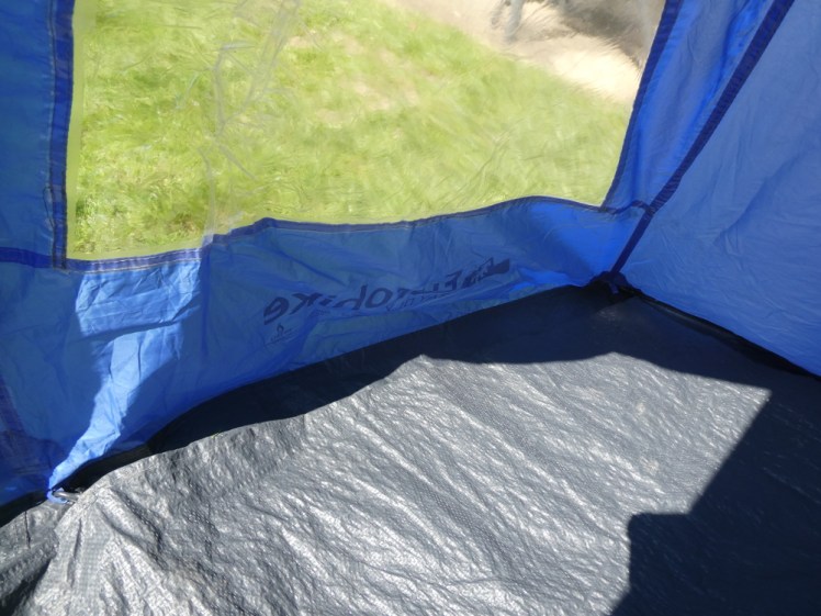 Porch groundsheet hooked into place