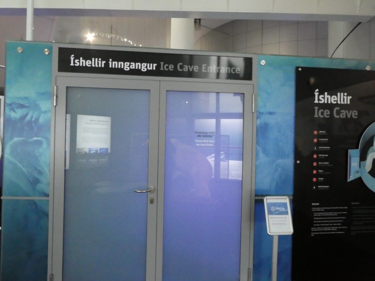 The entrance to the Ice Cave, a pair of frosted glass doors with a purplish glow behind them. From here, it looks like the ice cave is a glass box twenty feet long. Actually, this is just the entrance into one of the storage tanks.