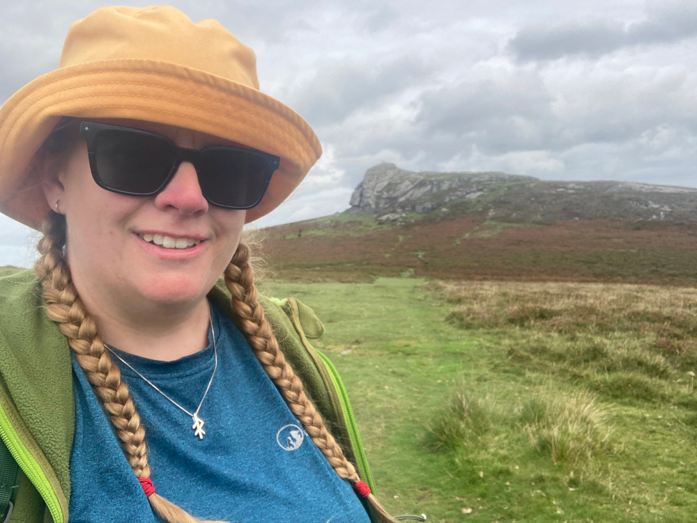 A selfie with Haytor. I'm wearing a blue top, green fleece and yellow bucket hat.
