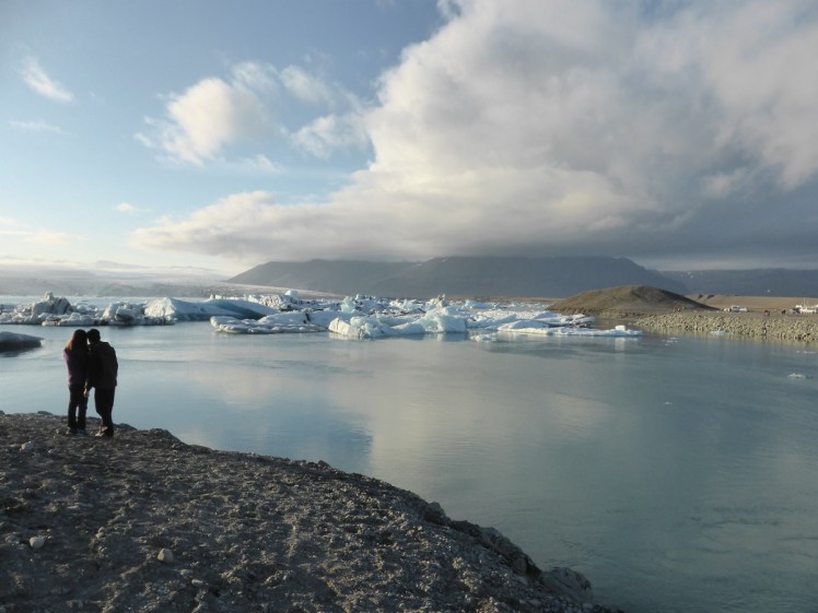 View over Jökulsárlón and mountains with loving couple