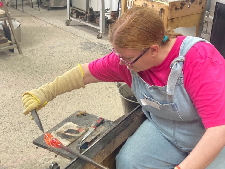 Me holding and rolling the pole in one hand and pulling it with a pair of tweezers with the other, turning it into a spiral.