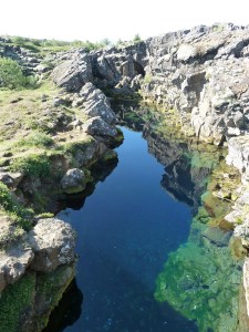 Peningagjá, a fissure flooded with ultra-clear spring water and used as a wishing well by passing tourists.