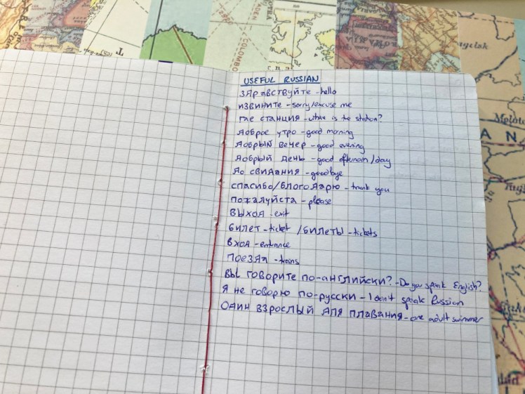 A home-made passport-sized notebook of squared paper. Written in blue biro in the central pages is a list of useful Russian vocabulary. Most of it is along the lines of social niceties but the last one is "one adult swimmer".