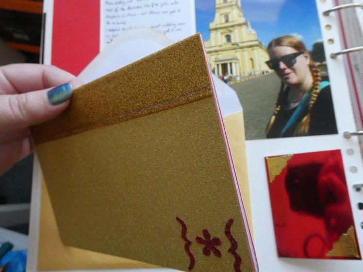 Close-up of a handmade perfect bound minibook. It's got a gold glitter cover and it strengthened with gold glitter duct tape.