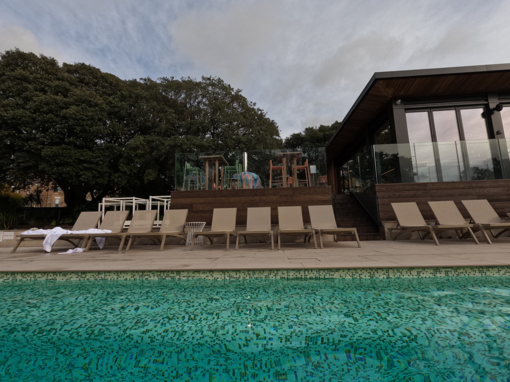 Old Harry Rocks restaurant, raised up above the outside pool. On the deck outside is a massive multi-coloured pizza oven.