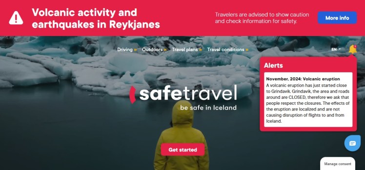 A screenshot from the safetravel.is website. There's a big red bar across the top to warn that there's an eruption going on and a red box with travel alerts.