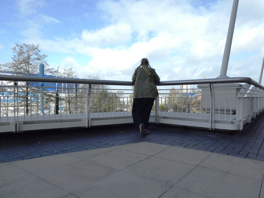 A timer selfie (probably using a bin as tripod) of me leaning over the railings around the Westfield shopping centre walkway as if I'm leaning on the rails of the imaginary cruise ship's deck.