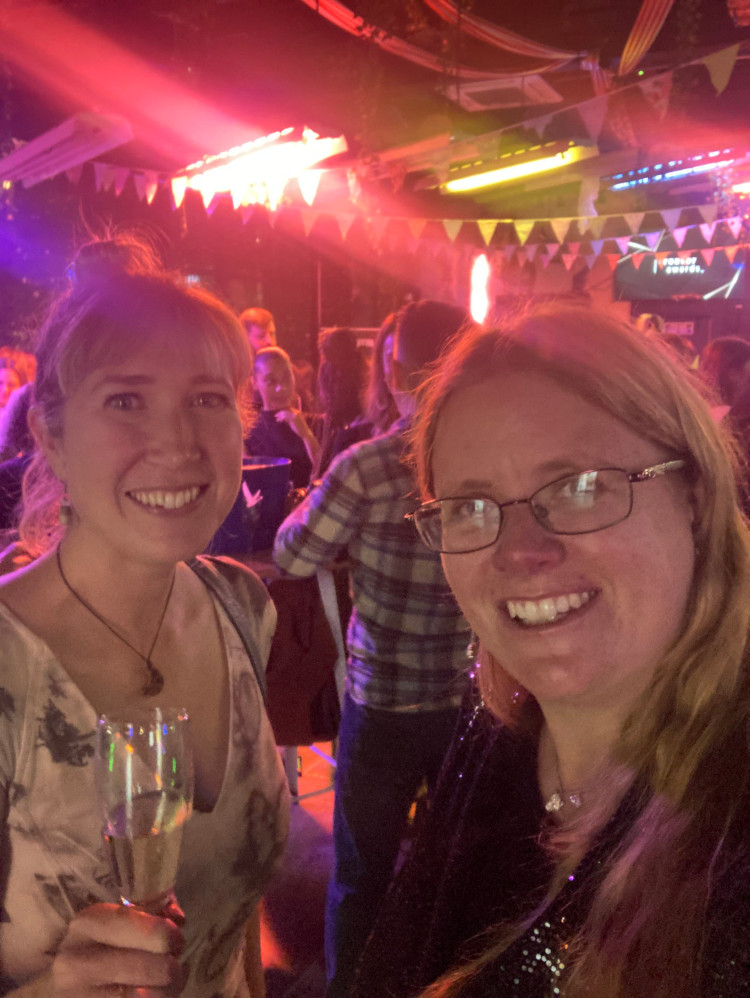 A selfie in a bar at the TCAs with Catherine, who's wearing a leafprinted dress. I'm wearing a sequinned blazer mini dress but you can't see much of it between the hair and the lighting - great blazes of pink across the picture.