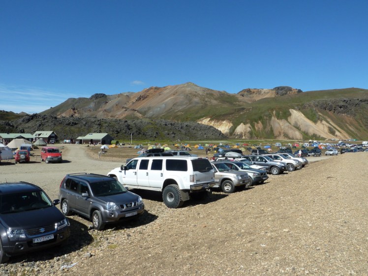 A lot of cars parked behind the campsite at Landmannalaugar.