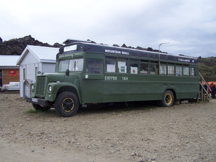 The Mountain Mall, two dark green American school buses with a little ladder sticking out of the back. You can't actually see the second one because of the angle the first is at.