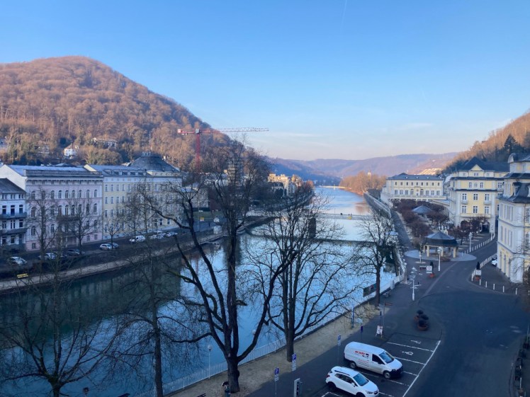 A view down the river from the hotel's rooftop terrace in Bad Ems. It's early enough in the morning and it's mid-February that it all looks quite cold - the sun hasn't yet risen above the mountain so although the sky is various shades of pastel pink and blue, the town itself is still pretty blue.