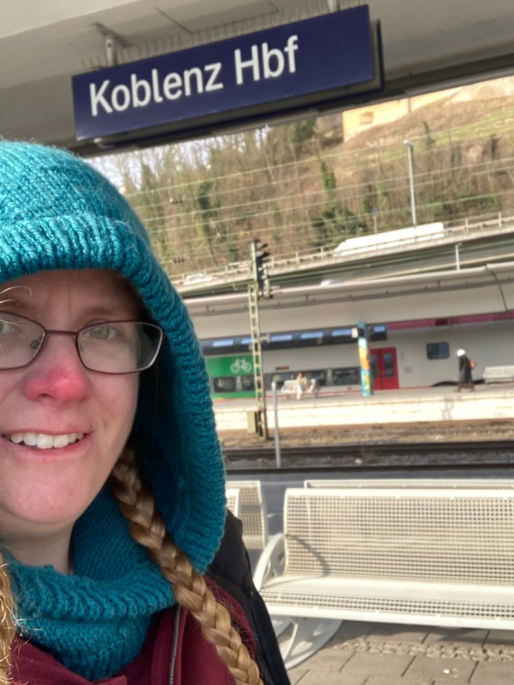 A selfie on the platform at Koblenz, with my blue hood up again.
