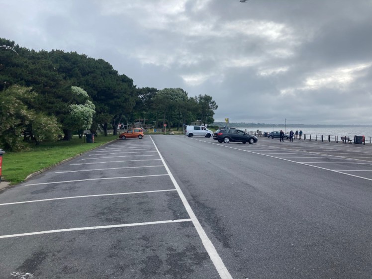 An almost completely empty car park in Dorset in July. Admittedly, it's not quite 9am and it's a grey morning but it's going to get better later on.
