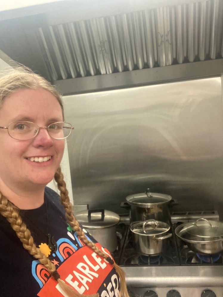 A selfie at the Brownie sleepover, wearing my Fearless Leader t-shirt, in front of the industrial kitchen that I'm in charge of.