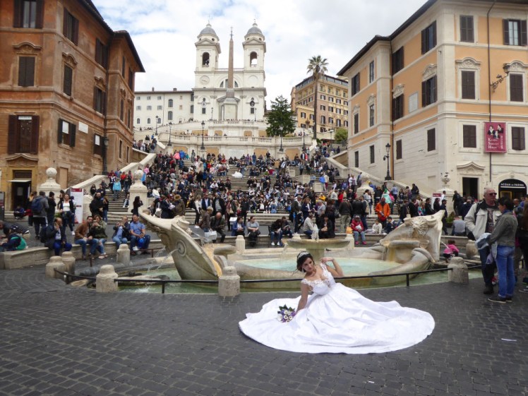 The Spanish Steps, so covered in people that you can hardly see the steps. A woman i a wedding dress is posing at the bottom and I'm pretty sure there's another one halfway up.