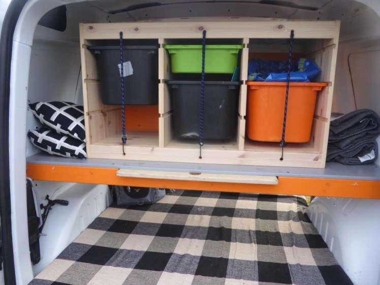 The big storage box blocking my rear view in the last van, which was in 2017. It's a wooden Ikea unit with the storage trays held in place by bungee cords.