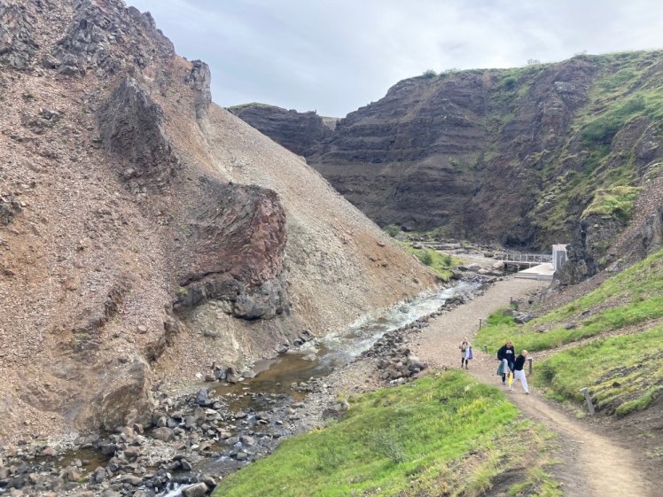I paused halfway up the canyon steps to take a photo of the view behind me. Some of the group are still climbing up. There's a river and the changing rooms and bridge and from this angle you can't quite see the pools.