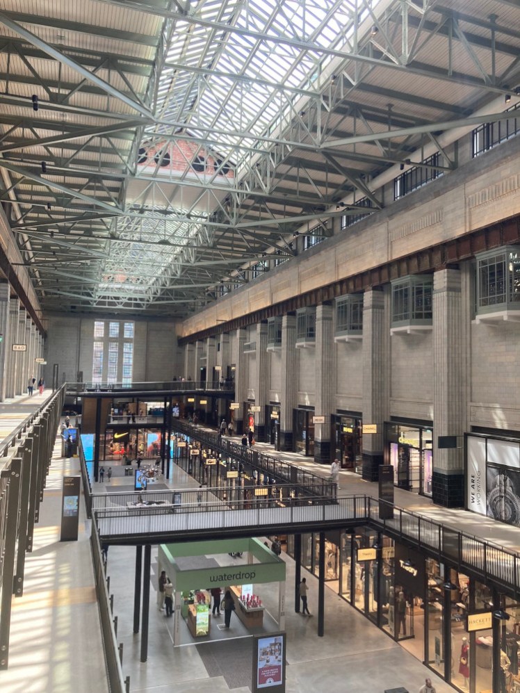 Turbine Hall A, a more refined version of its twin, with glass-sided walkways connecting the floors towards each end.
