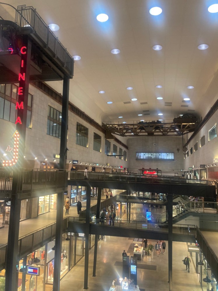 Turbine Hall B, a cavernous space with walkways making it three storeys high and bridges criss-crossing it.