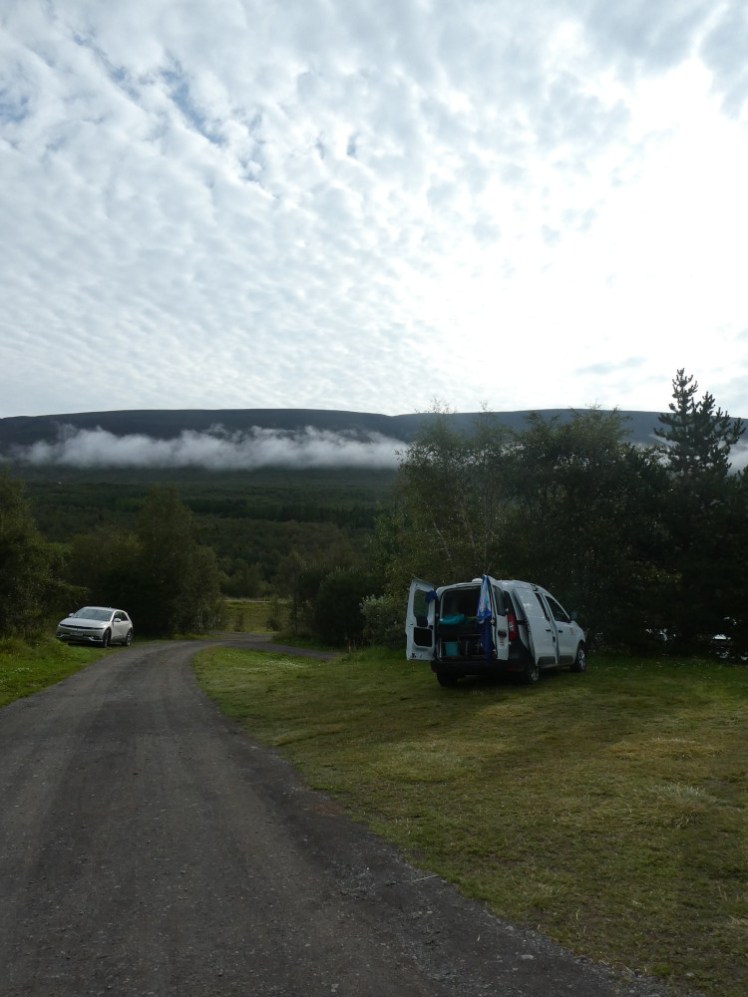 The van parked, at a slightly uncomfortable angle, at Systragil, a small campsite in a little wooded valley.