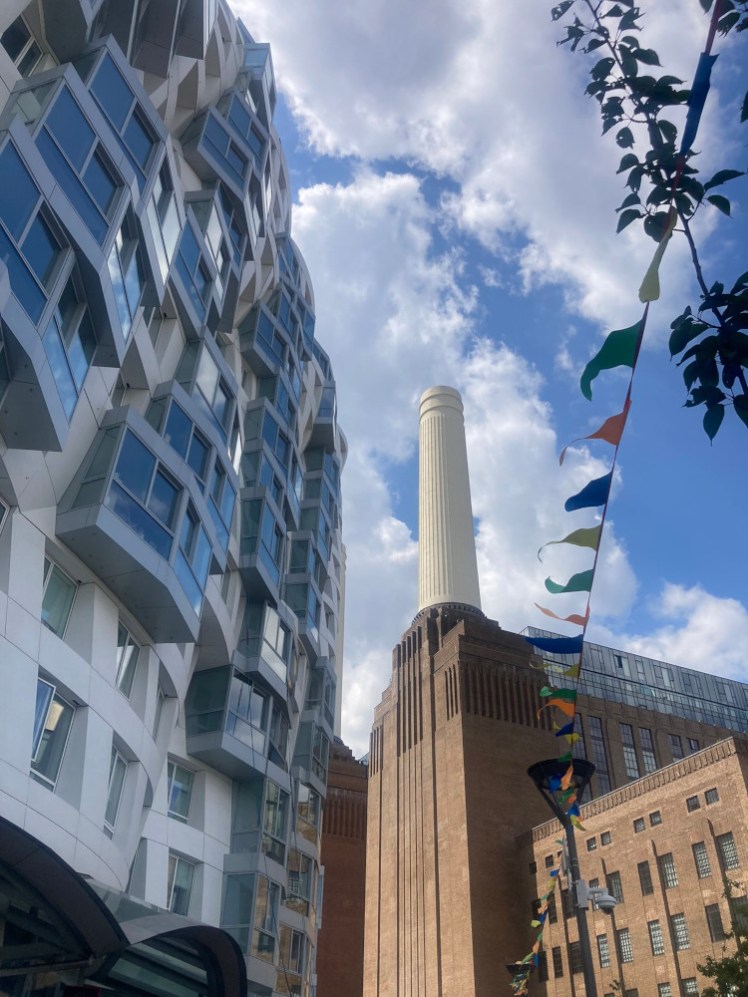 The view just after leaving the Tube station, of the power station ahead and the modern new building on the left as you approach.