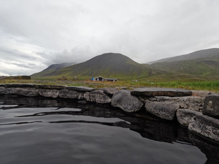 The view from Jarlslaug towards the campsite buildings and the mountains in the damp afternoon low cloud.