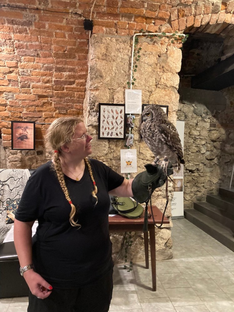 Me holding a large and fairly fluffy eagle owl, looking at it with the same awe. Mutombo is a lot lighter than he looks, being a lot more feather than most of the other birds.