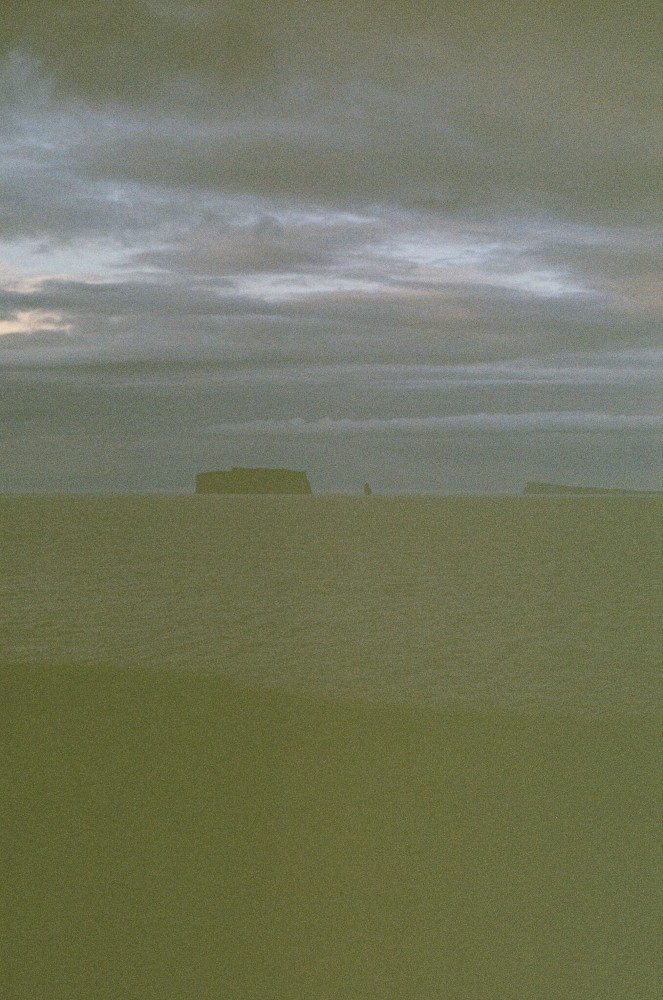 Drangey, a flat-topped island out at sea, far too late in the evening for film - this is very dark.