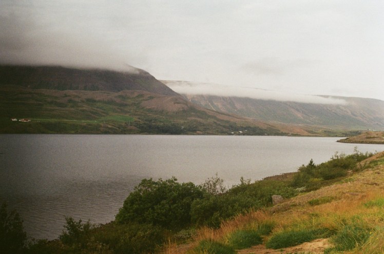 Ljósavatn, a small lake by the side of the road, on a cloudy morning.
