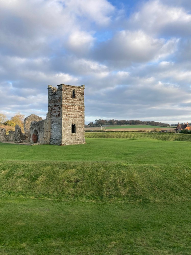 The church, seen from the tower end, from the other side of the henge. The ditch is very obvious but I'm standing on the rampart on the other side so the ditch just rises up to the flat area in the middle of the circle.
