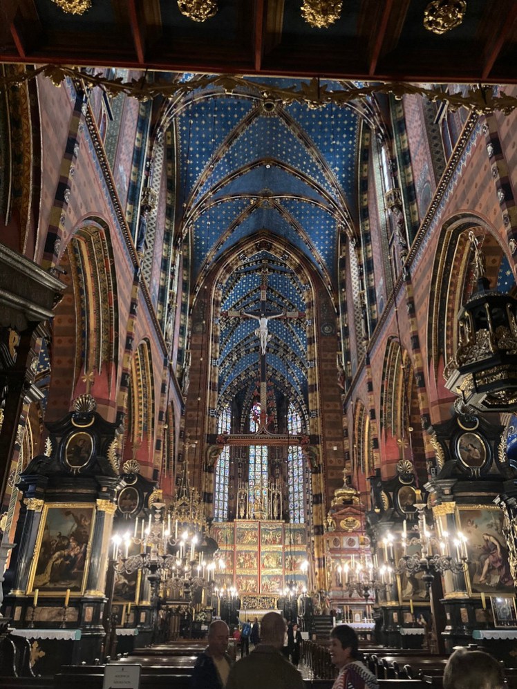 Inside St Mary's Basilica, a breathtakingly ornate Gothic abyss in shades of red and blue with lots of gold.