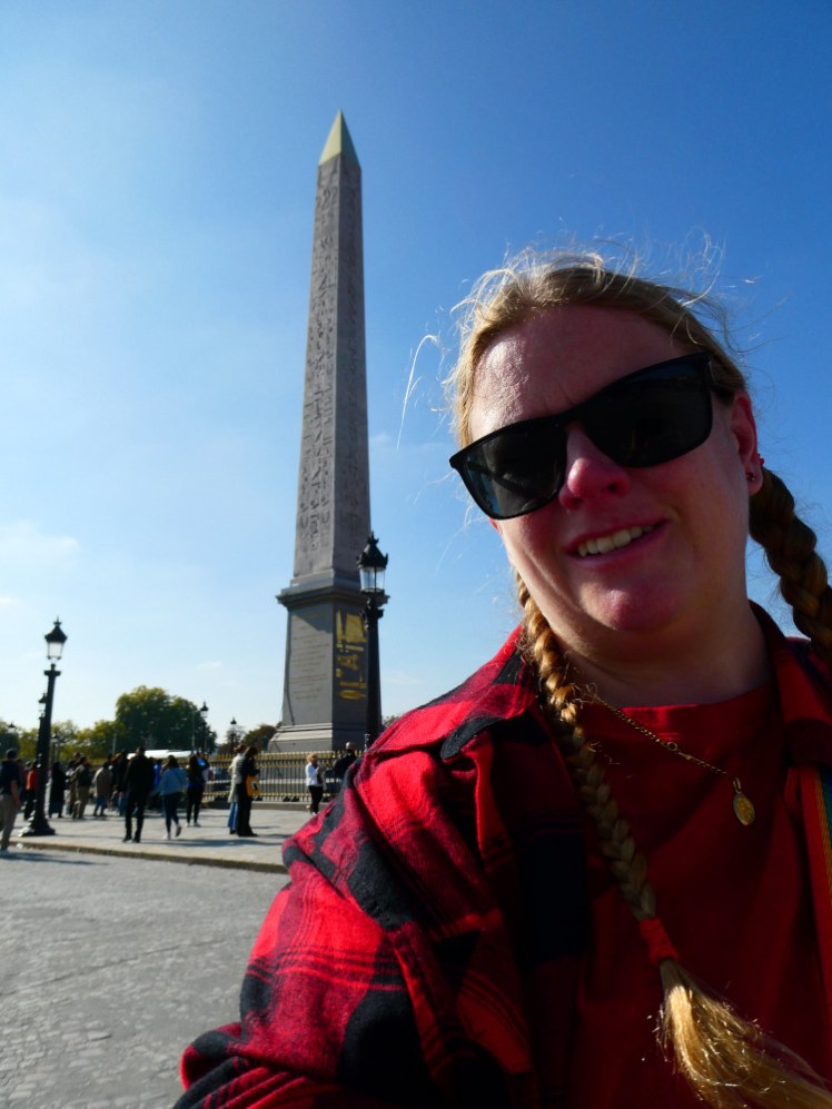 A selfie with the Luxor Obelisk on a very bright sunny day.