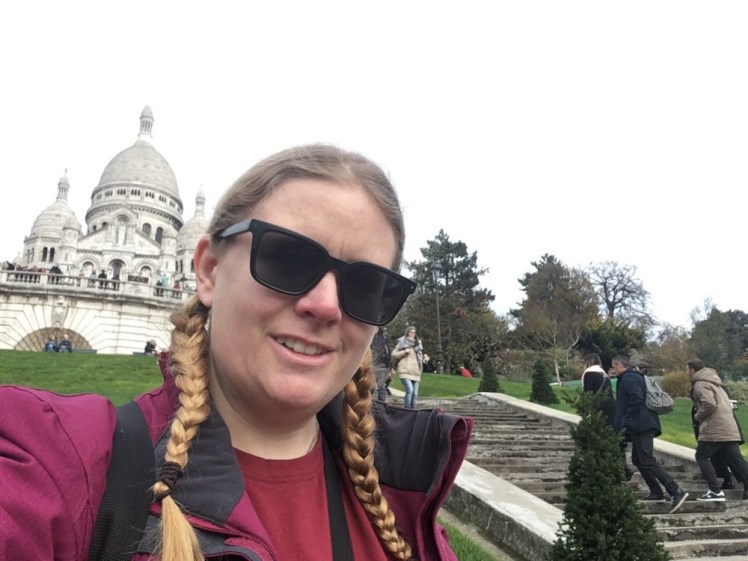 A selfie halfway up the hill with Sacré-Cœur behind me.