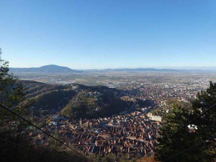 A view down over Brasov and the mountains that surround it from the landing platform of the cable car.