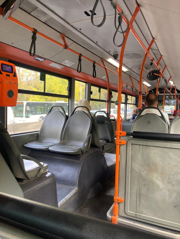 The inside of the bus I took to Snagov. The seats are plastic and quite slidey but there's hardly anyone else on it.