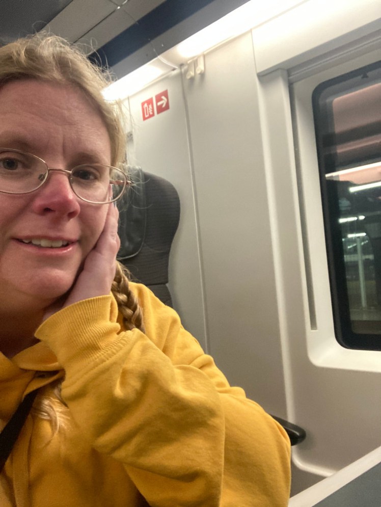 A selfie in a yellow hoodie on the Eurostar. This time I'm in the aisle seat but enjoying that the window seat is empty.