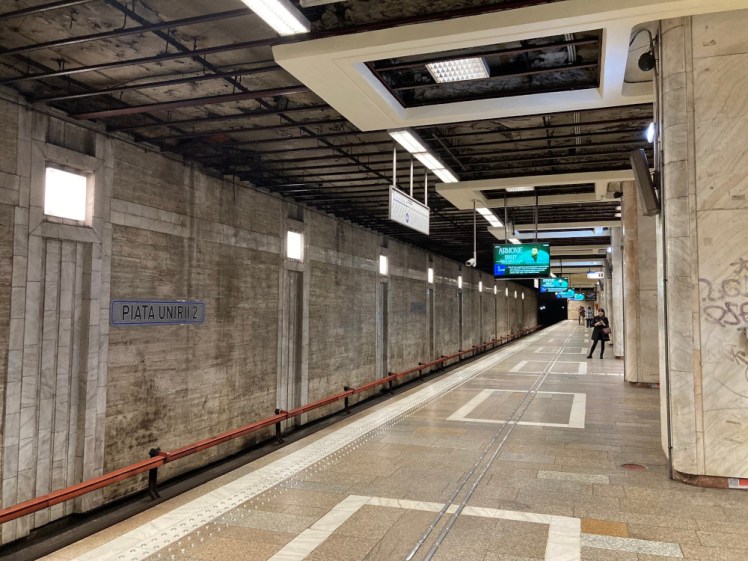The platform of the metro station at Piata Unirii 2, where the M2 comes in. It's mostly concrete and has a lot of right angles.