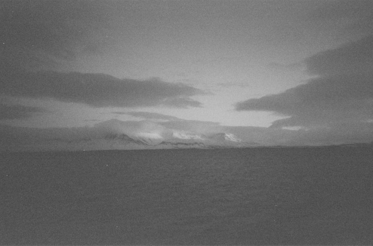 A view across the bay at Reykjavik to Esja, who's just a bit too clouded right now for its snow to reflect.