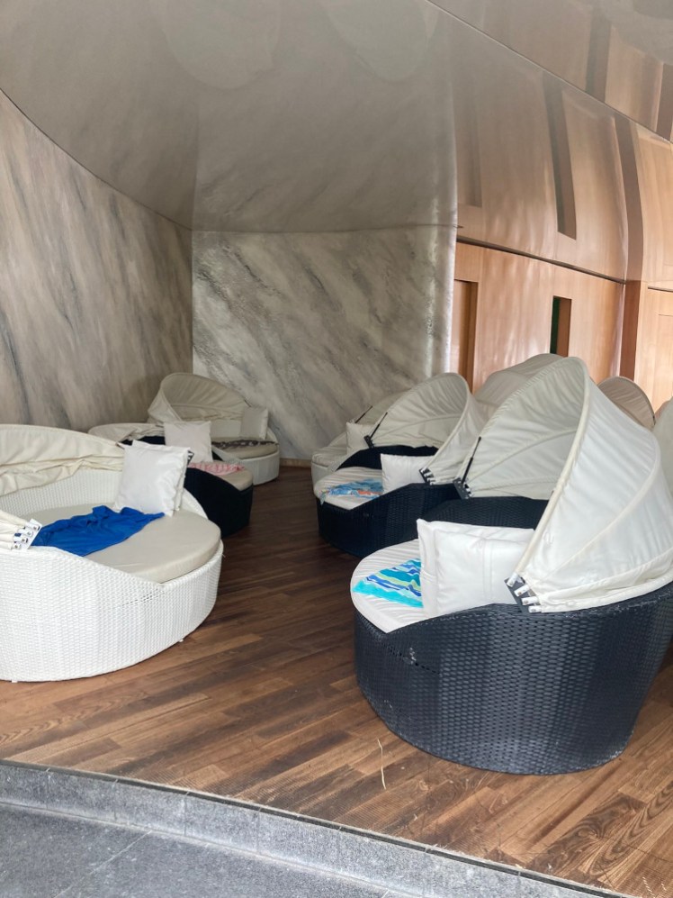 Comfortable round seats with retractable covers, all piled with towels before 10.30am.