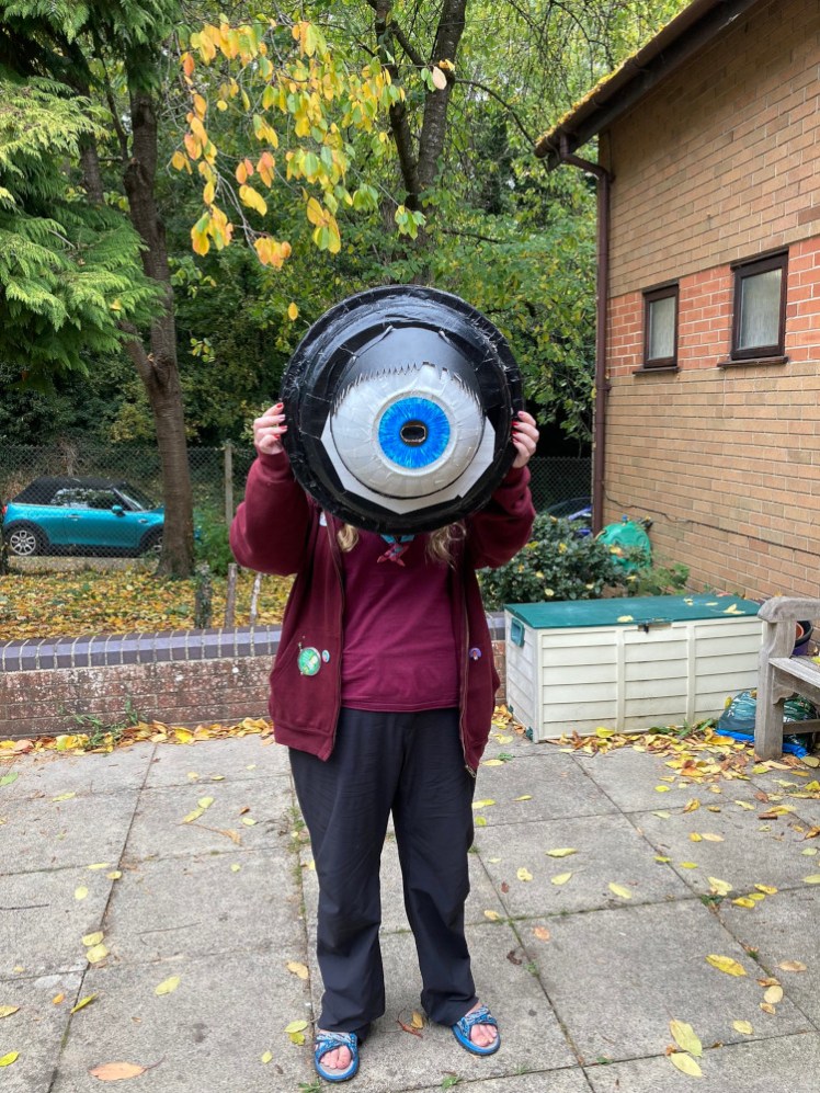 Me in Rebel "uniform" with a giant eyeball made out of a bin on my head. It's a camera obscura, I think.