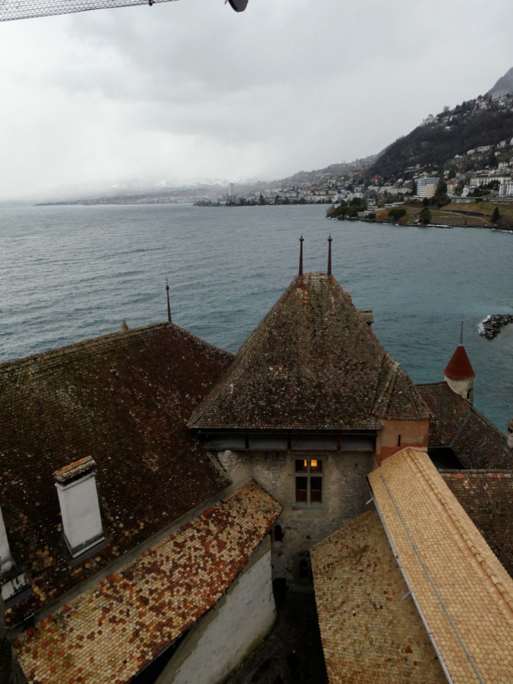 A view from the keep over the top of the castle, the lake and the mountainside beyond that.