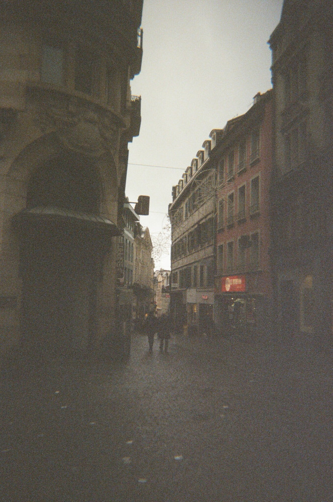One of the many narrow, winding streets in Lausanne, no doubt packed with designer shops that you can't really see in this picture.