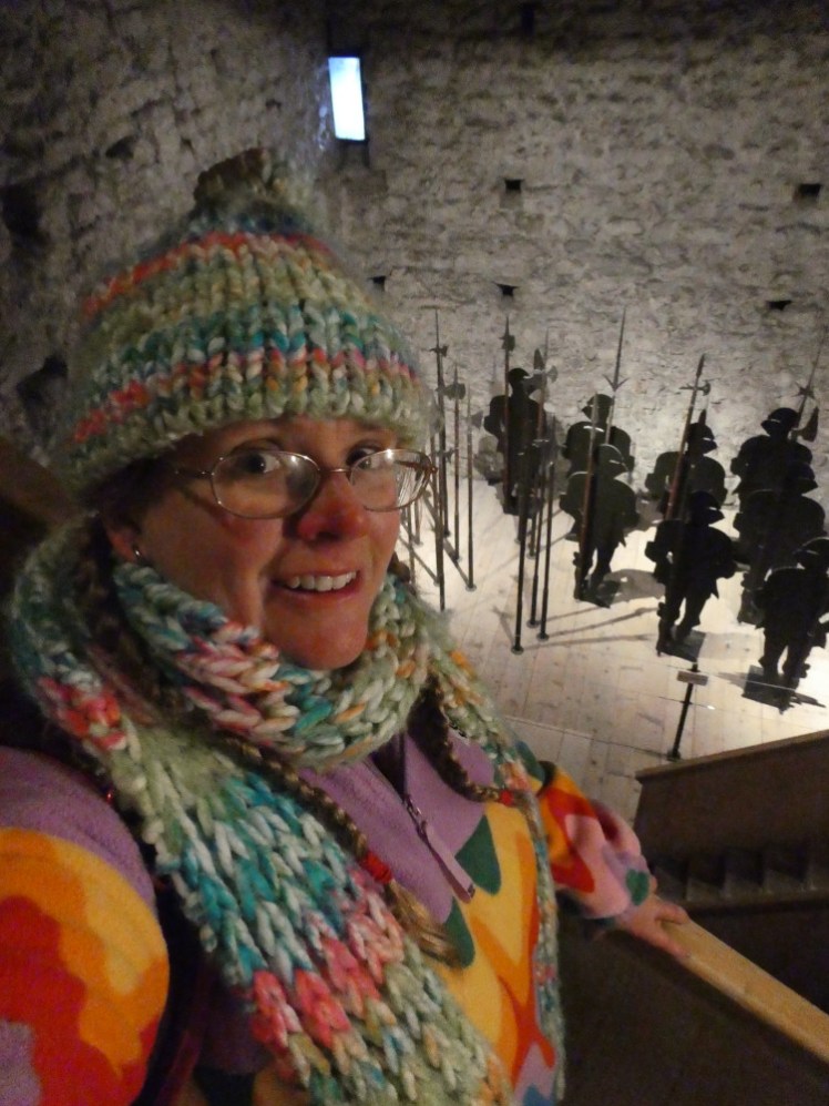 A selfie on the stairs above the hall of poleaxes, halberds and other long weapons.