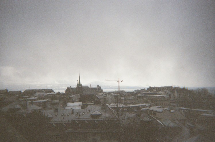 A view over Lausanne, the lake and the mountains in the distance as seen from the courtyard outside the cathedral. The city is lightly powdered in snow which wasn't there an hour or so earlier when I arrived at the cathedral.