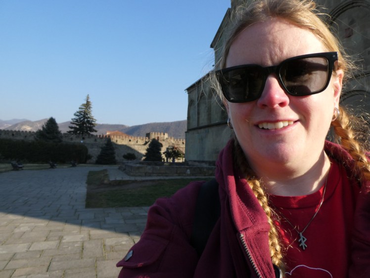 A selfie in Mtskheta in Georgia a couple of days after my sulphur bath. I'm wearing a silver bindrune pendant representing energy which is noticeably blacker and more tarnished than it should be.