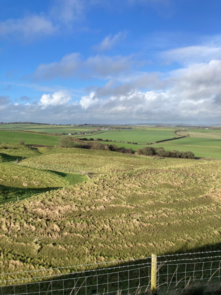 Countryside views with an unusually blue sky for the time of year after I climbed a hillfort on my way to the spa.