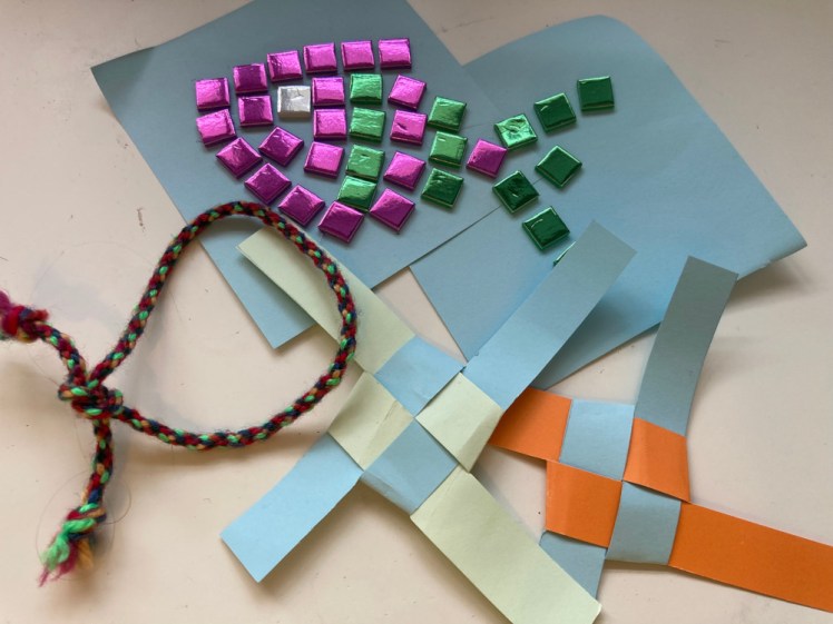 My Trefoil crafts - a mosaic fish in purple & green, two paper friendship knots and a friendship bracelet.