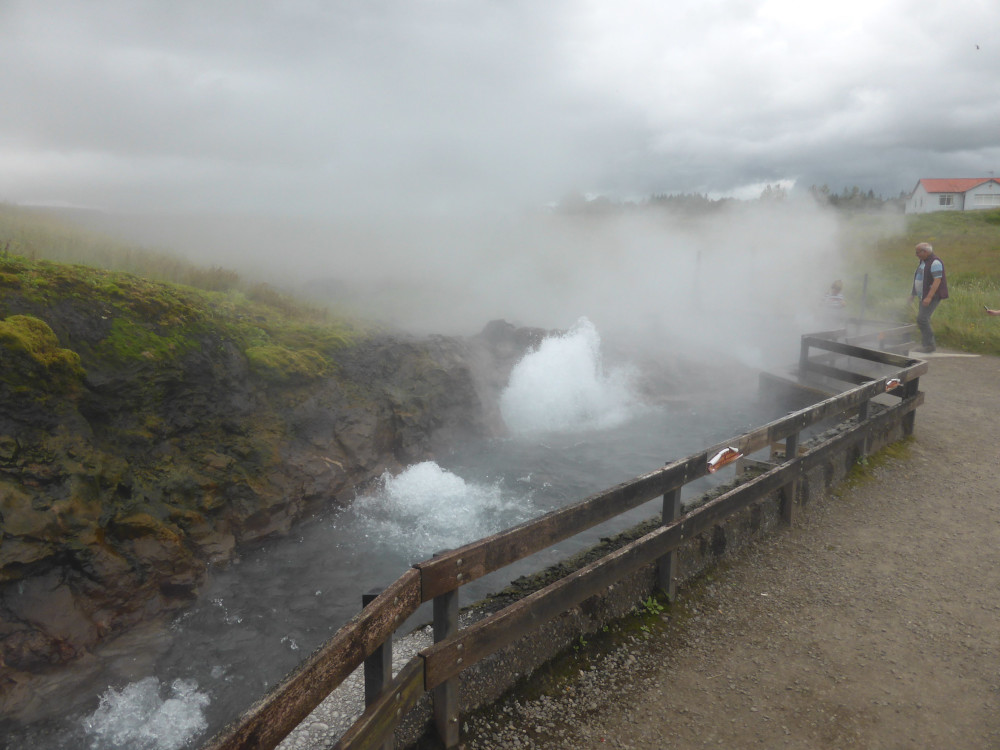 Deildartunguhver bubbling up boiling water out in the car park (before Krauma was built; it will be on the slope up to the right).