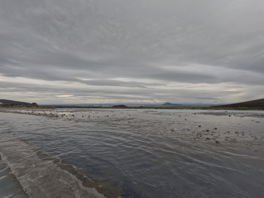 A view down to Myvatn and the mountains on the horizon from the edge of the furthest pool.