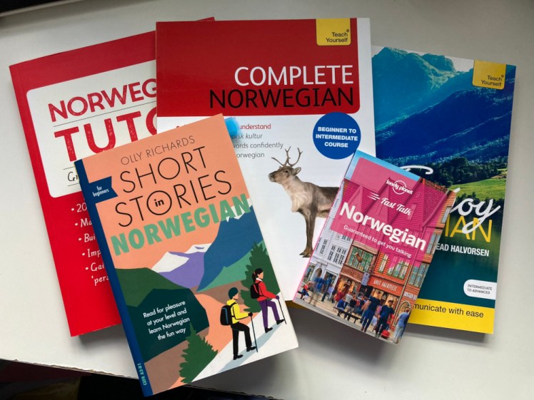 The collection of Norwegian books I've amassed over the last decade: Complete Norwegian & Enjoy Norwegian, Norwegian Tutor (the grammar books), Short Stories in Norwegian and a Fast Talk Norwegian phrasebook.